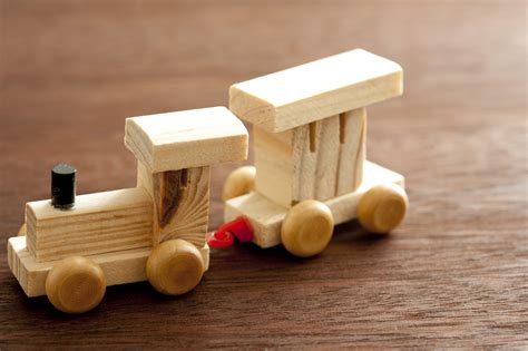 Free Stock Photo 11986 Wooden Train and Caboose Car on Wood Surface | freeimageslive