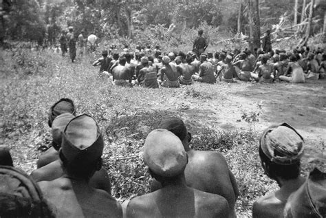 3 Indonesian villagers are forced to watch as commandos from Captain ...