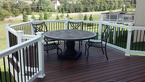 Trex Composite Decking, White Vinyl Rail System, Black Aluminum Balusters | Outdoor furniture ...