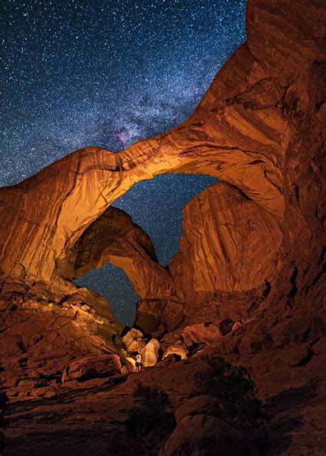 This is a nighttime view of Double Arch in Arches National Park, Utah ...