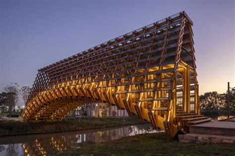 Arched timber bridge by LUO studio allows boats to pass under bridge ...