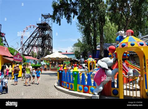 Coal winding gear and children's rides at Gold Reef City Theme Park, Johannesburg, Gauteng ...