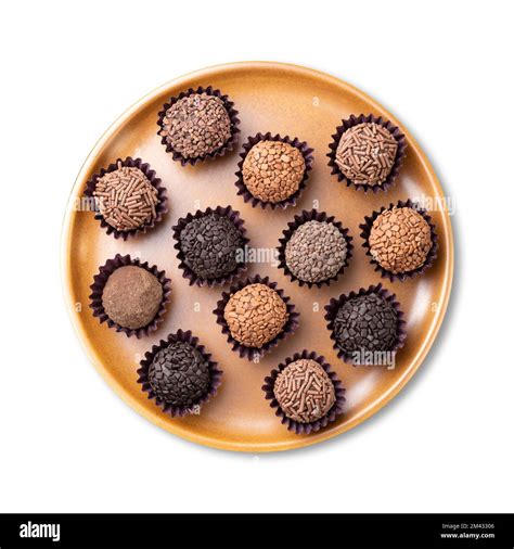 Typical brazilian brigadeiros, various flavors on a brown plate ...