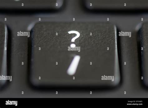 Forward slash and question mark key on a laptop keyboard Stock Photo ...