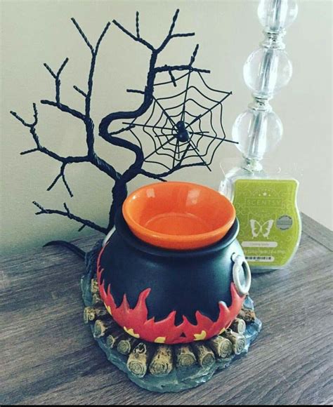 The cutest halloween scentsy warmer!!!! On sale this month 49.50+ tax it's called Hocus Pocus ...