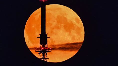 Harvest Moon: Stunning images from across the world as lunar eclipse ...