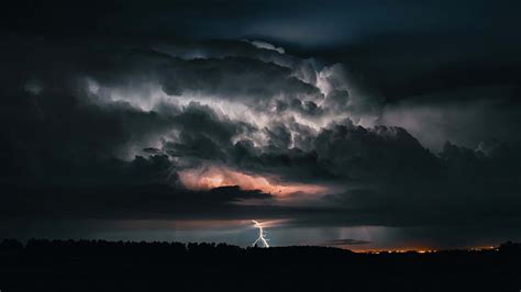 Download Majestic Thunderstorm Unleashing its Power | Wallpapers.com