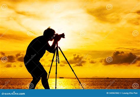 Silhouette Of Photographer With Tripod Stock Photo - Image: 34362362