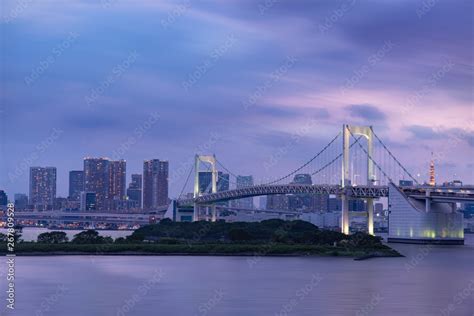 Rainbow bridge, Tokyo skyline and Tokyo tower, evening scene Stock Photo | Adobe Stock