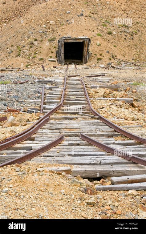 Old rail tracks leading to an abandoned mine shaft in Yukon Territory Stock Photo - Alamy