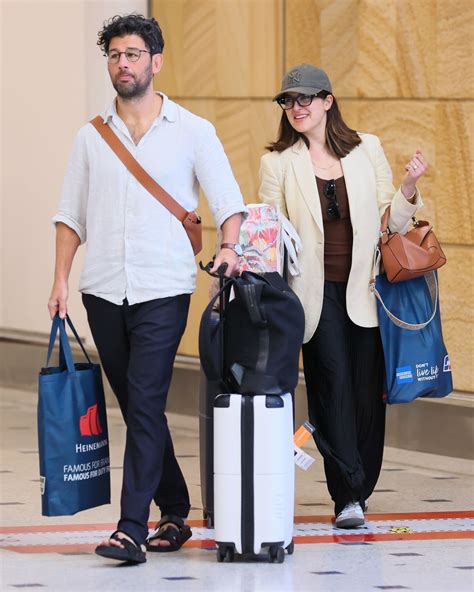 Sarah Abo and Husband Cyrus Moran at Sydney Airport 08/27/2023 • CelebMafia