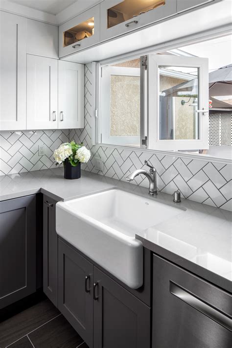 Remodeled kitchen complete with white subway tile backsplash in herringbone pattern, … | White ...