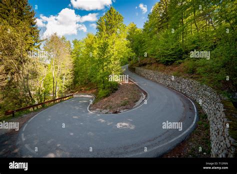 bend in the mountain road Stock Photo - Alamy