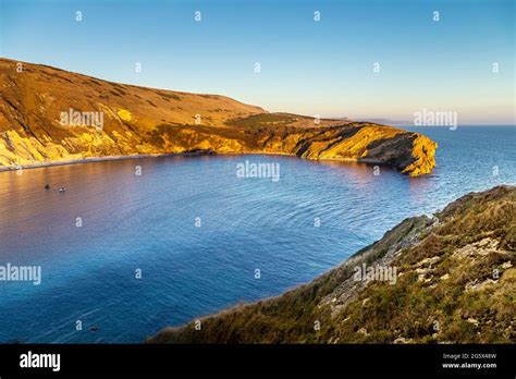 Lulworth Cove at sunset, Dorset, UK Stock Photo - Alamy