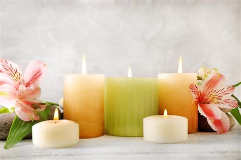 Premium Photo | Still life with spa candles on light wallpaper background