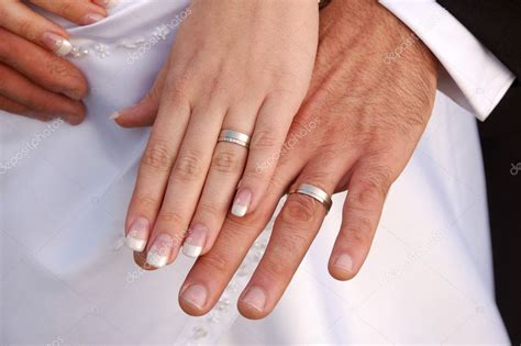 Bride and groom showing wedding rings — Stock Photo © jankratochvila #3085252