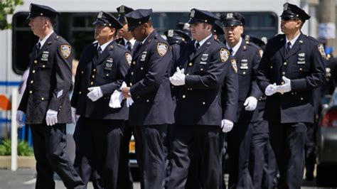 Solemn Sea of Blue as Officers Attend NYPD Cop's Wake - ABC News