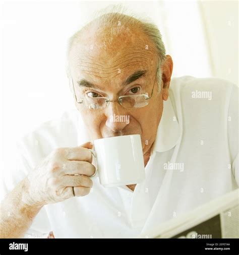 Portrait of a senior man drinking coffee Stock Photo - Alamy