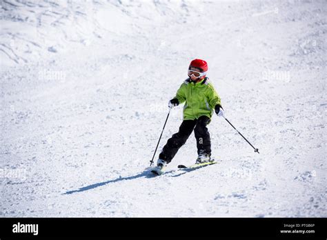 Beginner child learns to ski Stock Photo - Alamy