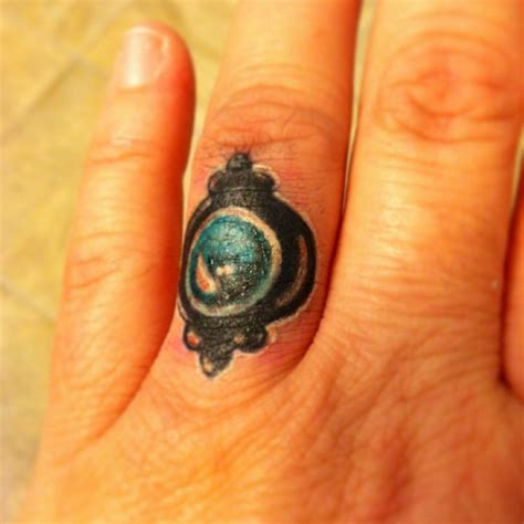 Finger tattoo | Finger tattoos, Turquoise ring, Tattoos