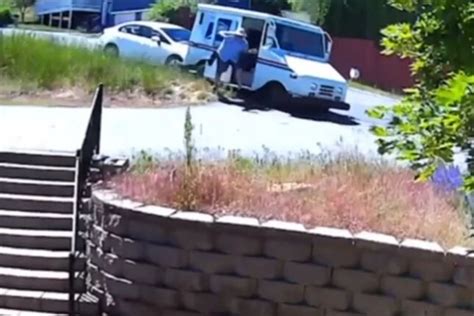 VIDEO - Postal Vehicle Struck by Car - Driver Escapes Injury