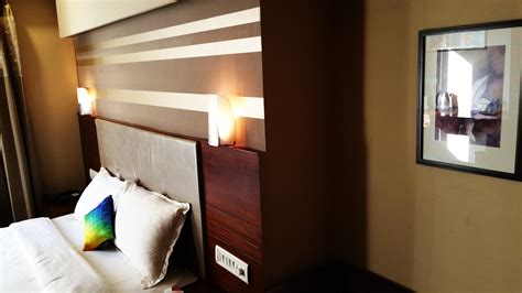 Empty Bed With Wooden Headboard and Lamps · Free Stock Photo