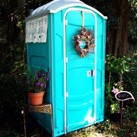 If you've GOT to us a porta-potty, how 'bout this one? (Complete with a rug and potpourri inside ...