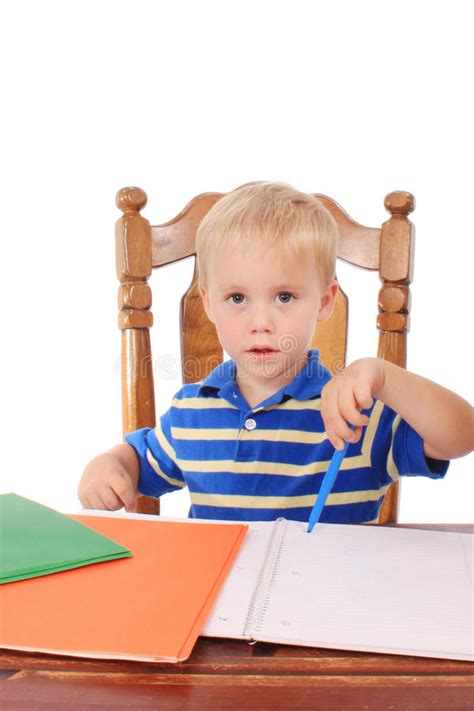 Boy at a desk stock image. Image of caucasian, hands - 20308913