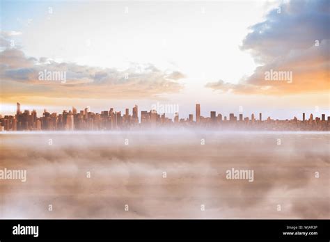 Cityscape on the horizon Stock Photo - Alamy