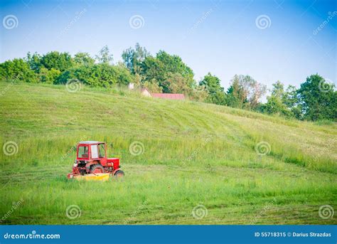 Tractor cutting grass stock image. Image of hills, cutting - 55718315