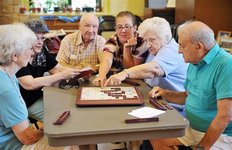 Indoor Group Activities for Seniors Promote Socialization. Seniors playing scrabble - Activities ...