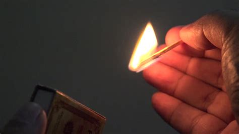 Slow Motion. Man Lights A Match In Darkness. How To Strike Matchstick ...