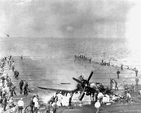 Crew of USS Oriskany fighting a fire caused by a F4U-4 Corsair fighter landing accident off ...