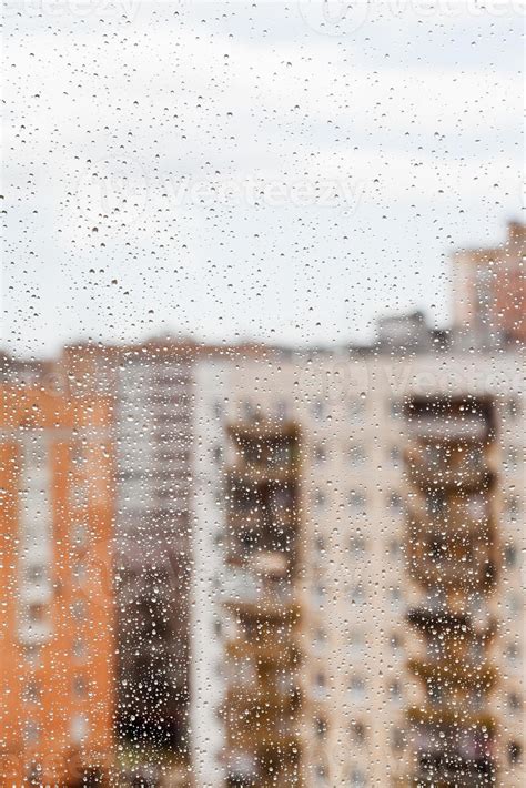 rain drops on glass window 11440335 Stock Photo at Vecteezy