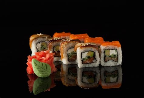 Premium Photo | Sushi on black background