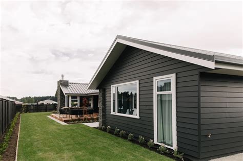 Black weatherboards aren't just for modern homes, achieve a classic ...