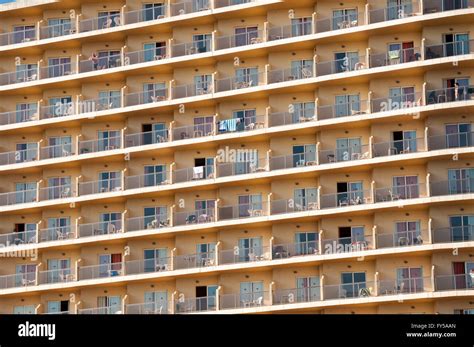 Rows of balconies on the facade of a large hotel complex in ...