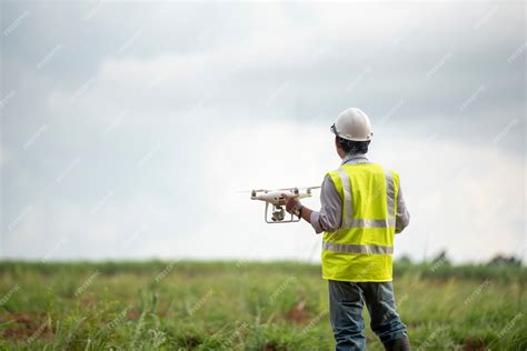 Premium Photo | Construction engineer control drone survey land for real estate development