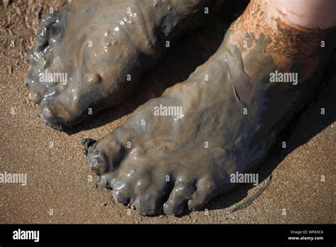 Mud covered feet hi-res stock photography and images - Alamy