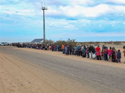 Largest single group of migrants ever tunnels under border wall in ...