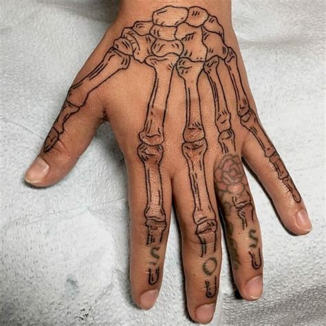 101 Amazing Skeleton Hand Tattoo Ideas That Will Blow Your Mind! - Outsons