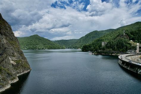 Dam and Hills around Lake · Free Stock Photo