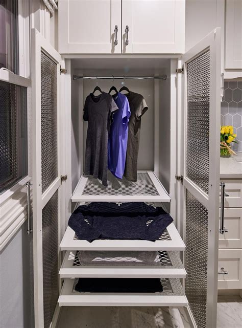 Custom Drying Cabinet for Laundry Room featuring pullout drying racks and a space to hang ...