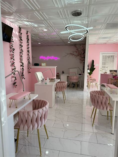 Pink Nail Salon Interior with Pink Chairs and Gold Trimmings