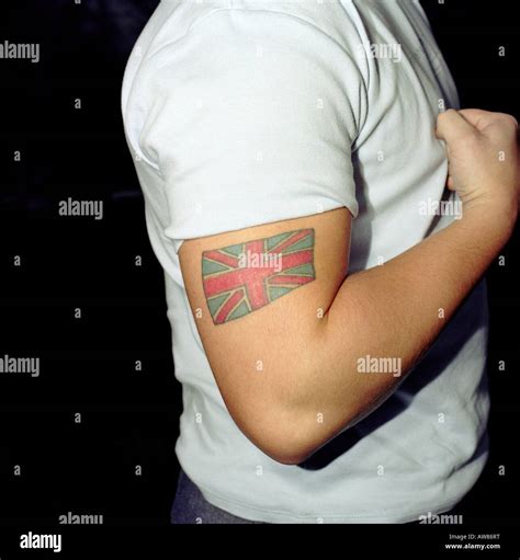 portrait of a man with a england flag tattoo on his arm Stock Photo - Alamy