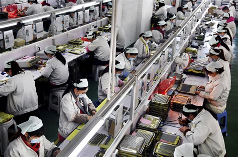 China's factories try to shield workers as output revives