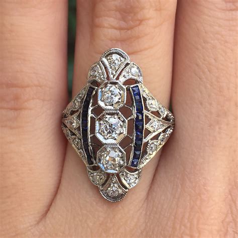 Vintage Platinum Filigree Navette Style Diamond and Sapphire Ring (circa 1920s)