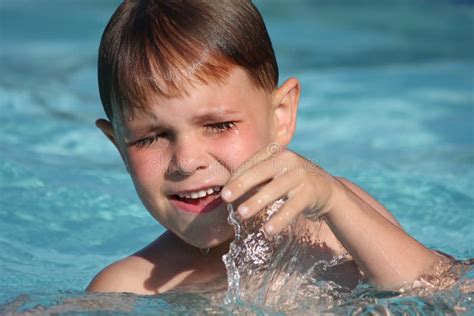 Boy Smiling in Swimming Pool Stock Image - Image of summer, outside ...