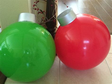 Giant ornaments. Easy to do. Big bouncy balls+plastic cup+ wire ...