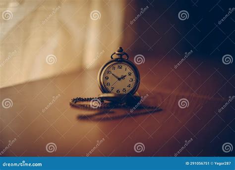 Vintage Pocket Watch on a Wooden Table Stock Image - Image of chain ...